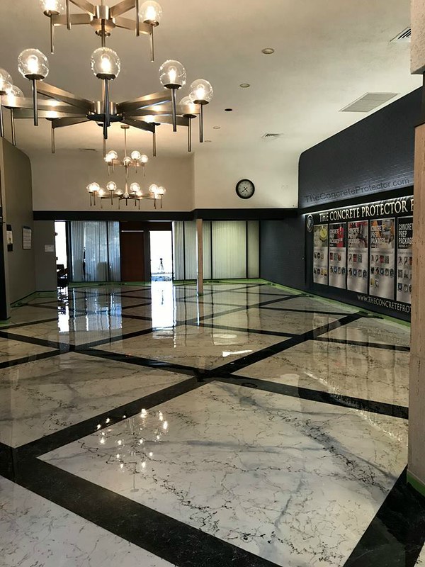Image of an Italian Marble Epoxy Showroom Floor, showcasing a highly realistic marble pattern with a glossy, reflective surface, providing a durable and attractive surface for showcasing products in a showroom setting.